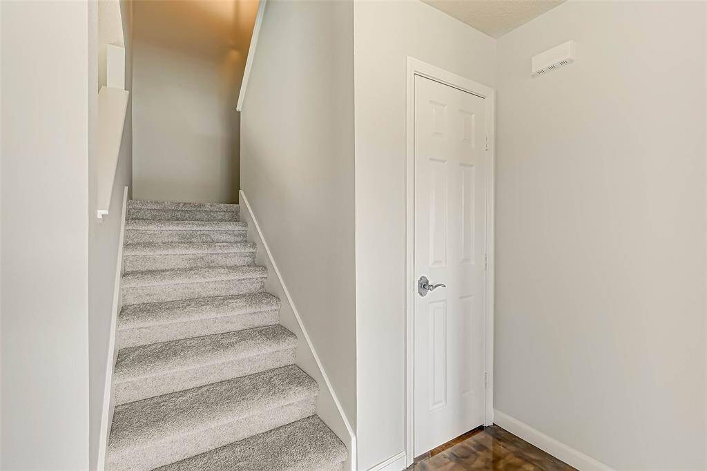 The spacious primary bedroom is located upstairs.