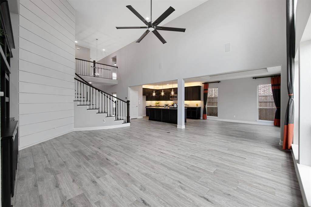 There are 2 built in speakers on the wall in the living room along with custom designer window treatments.