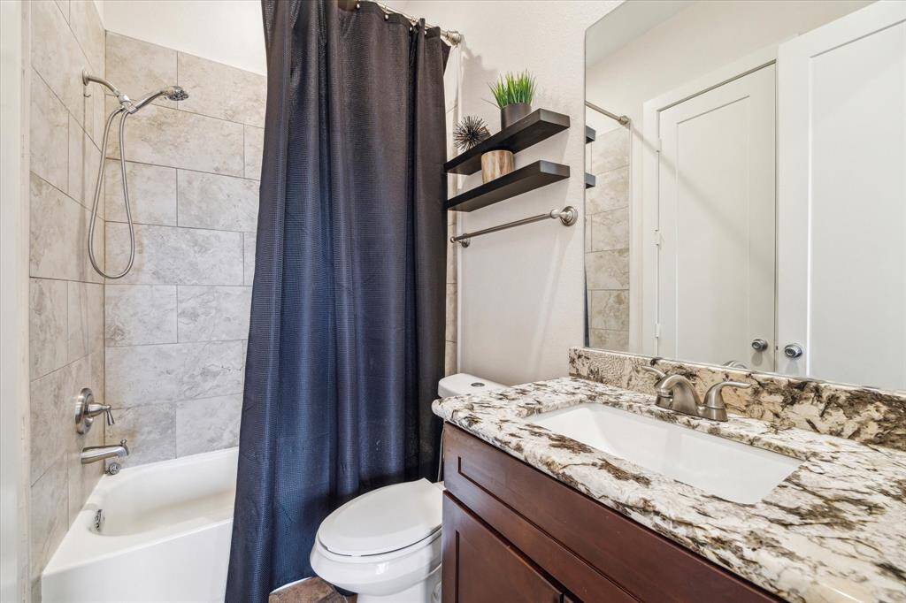 En suite bathroom features a tub.