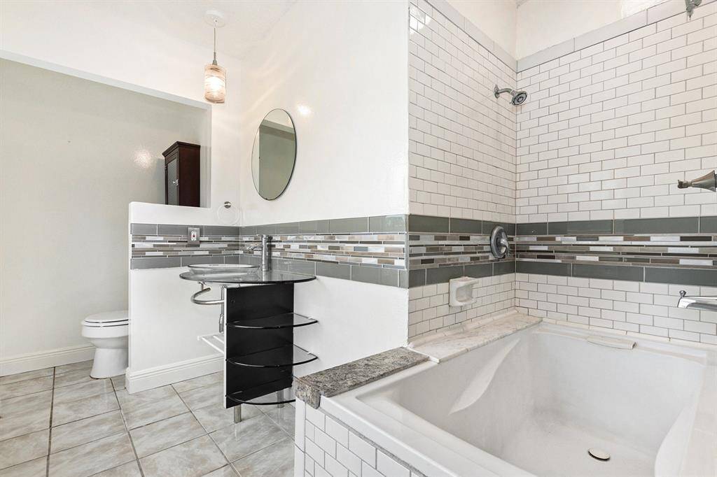 Primary en suite with a combination tub and shower.