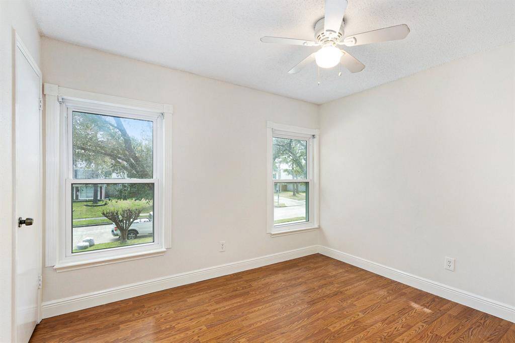 Upstairs secondary bedroom with a walk-in closet.