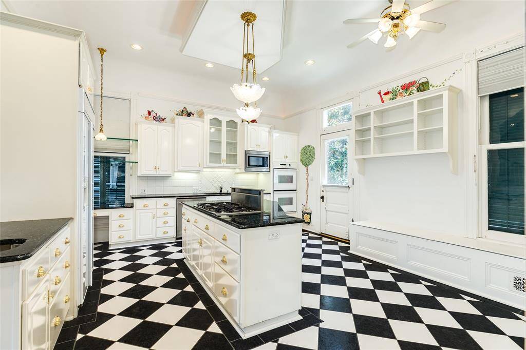This view of the kitchen shows the breakfast nook on the right. Not pictured a half bath and more built-ins.