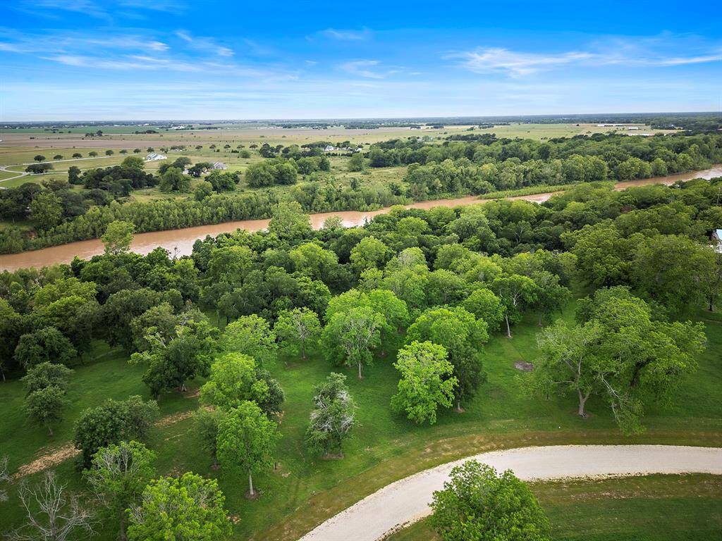 Embrace the acreage lifestyle in the gated Southern Manors community, all while remaining close to the amenities and energy of a thriving town.