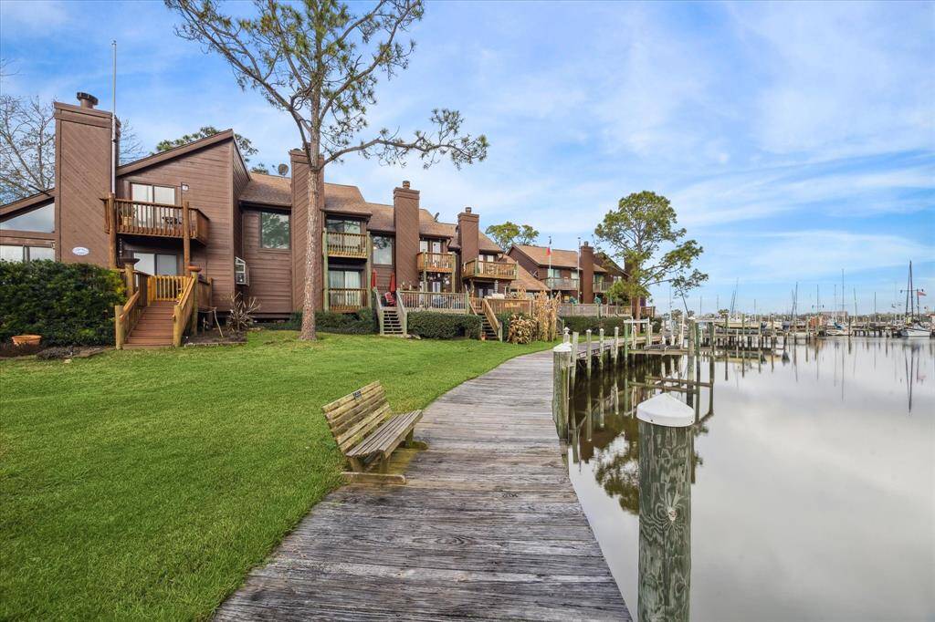 BACK OF THE TOWNHOUSE HIGHLIGHTS THE MARINA VIEWS AND BALCONIES.