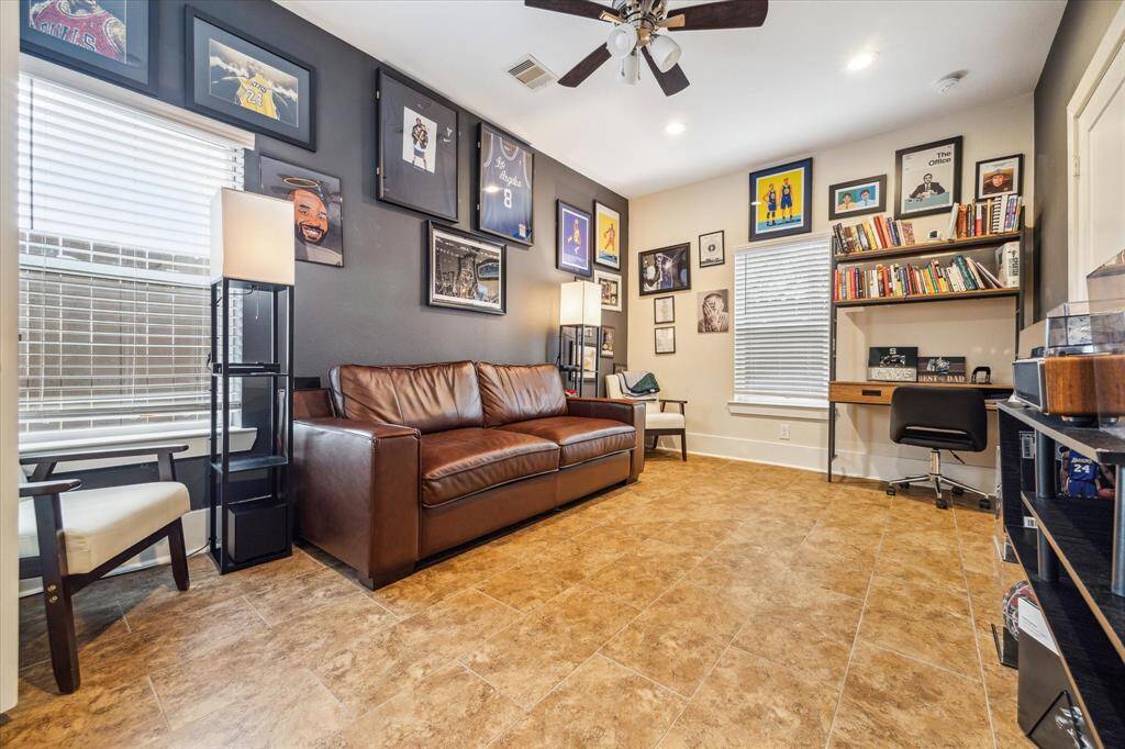 Heading back downstairs to the first floor, you have your Downstairs Secondary Bedroom that has tile floors, recessed lights & an en suite bathroom - ideal for guests or in laws!