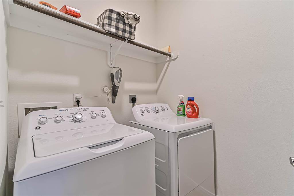 Convenient first-floor utility room located just off the kitchen.