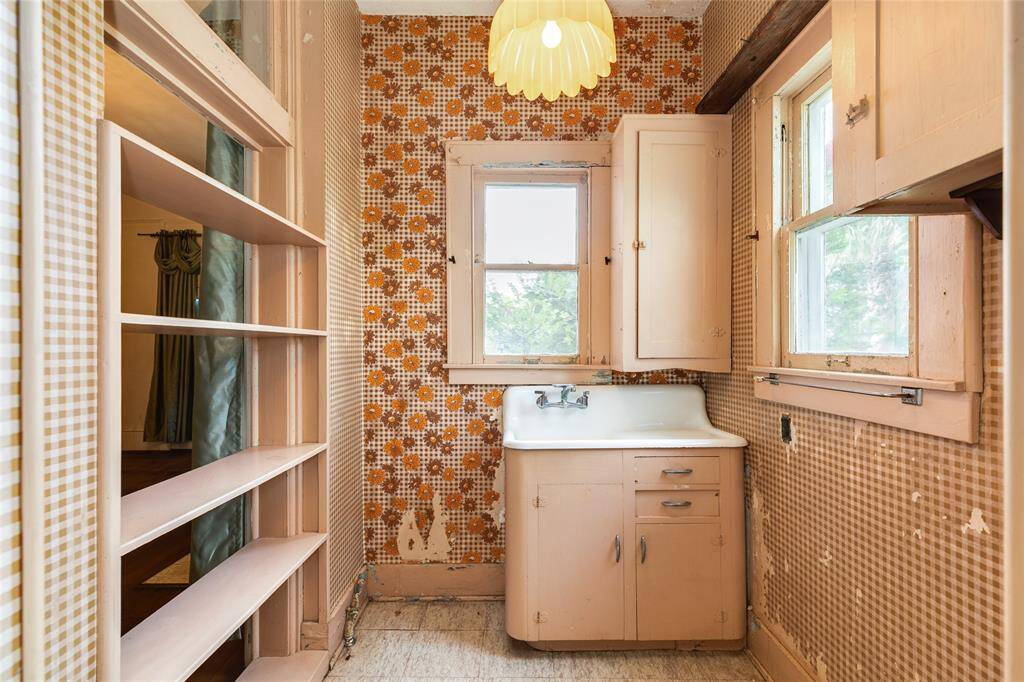 This vintage morning kitchen is on the main level on the West side of the mansion and the windows that were removed to create doorways are in the attic and could be replaced if the morning kitchen were removed. It could also be updated and kept.