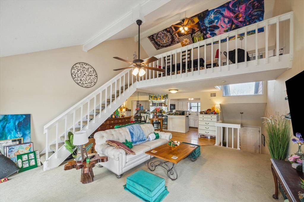 STAIRS LEADING TO THE 3RD LEVEL LOFT.