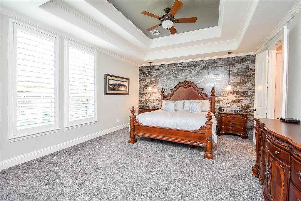 The primary bedroom has an additional fireplace behind the dresser!