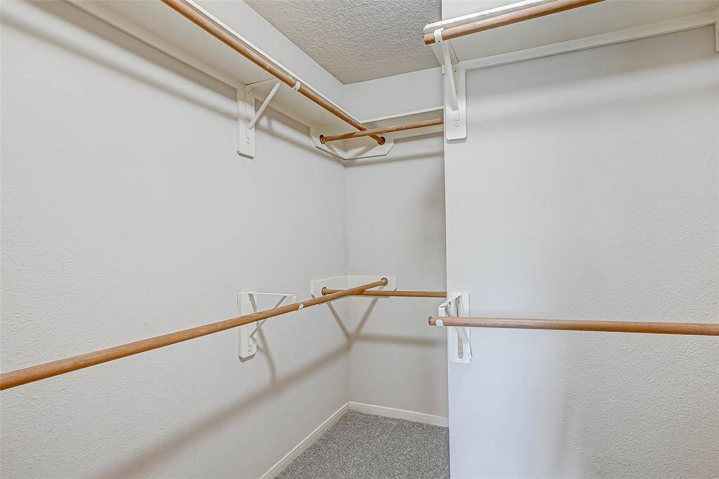 To the left is the secondary bathroom and two bedrooms straight ahead.