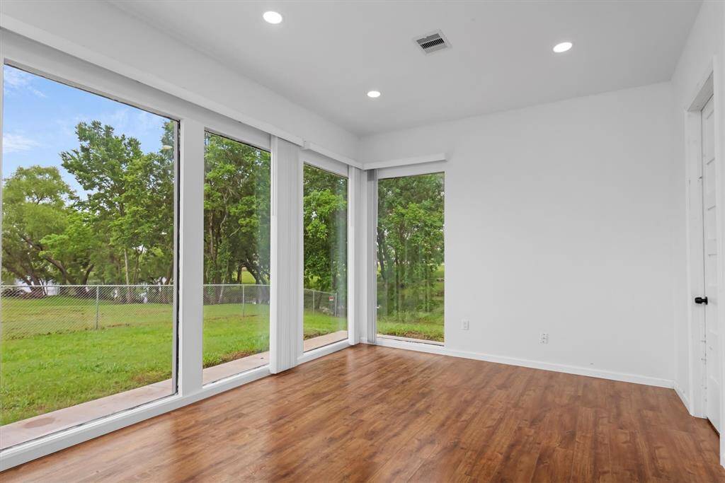 Dining area off of the kitchen overlooking the nearby pond.