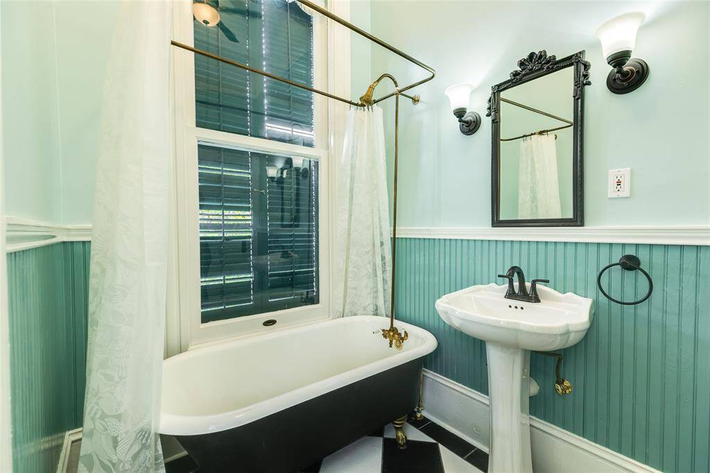 This main level full-bath is attached to the main level bedroom on the West side of the manion.
