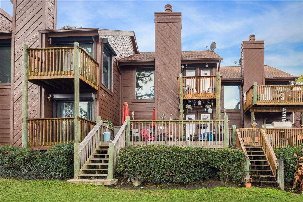 REAR ELEVATION WITH STAIRS LEADING TO THE MARINA.