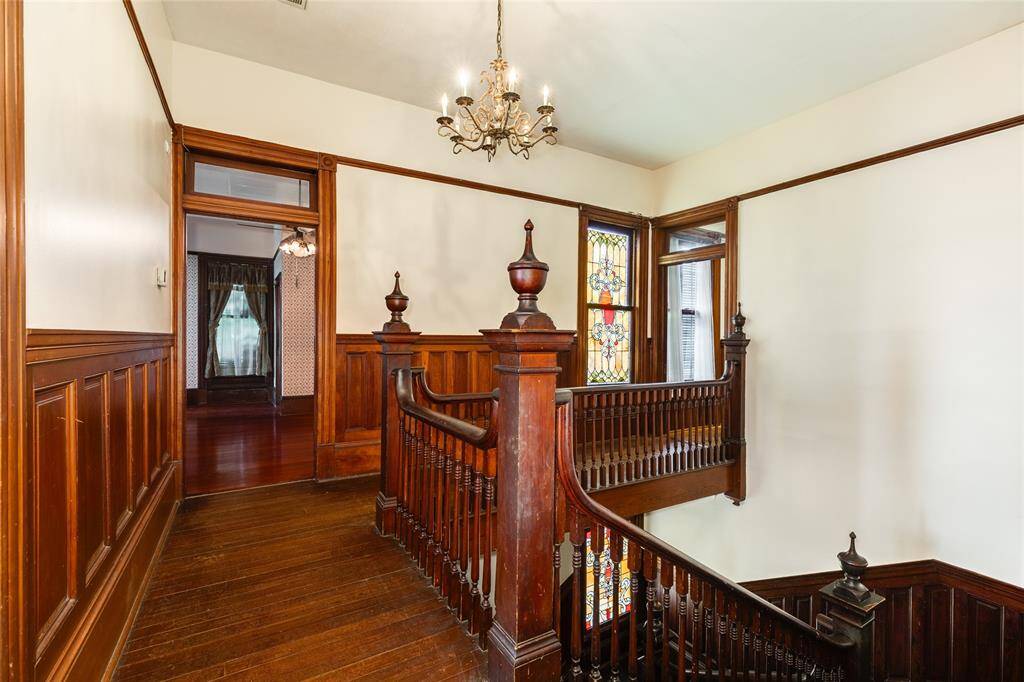 At the top of the staircase looking back toward the West wing of the upstairs.
