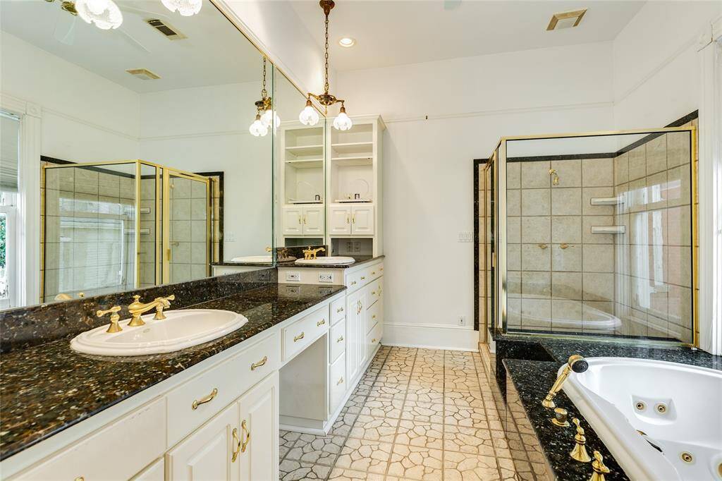 The Primary en-suite is quite large, offering loads of counter space, double sinks, a walk-in shower, a huge whirlpool tub and room for vanity seating. So much storage...