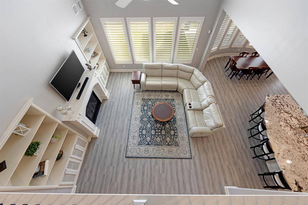 The view from the upstairs landing offers a breathtaking perspective, allowing you to look out over the home’s open living spaces or enjoy the scenic beauty beyond the windows.