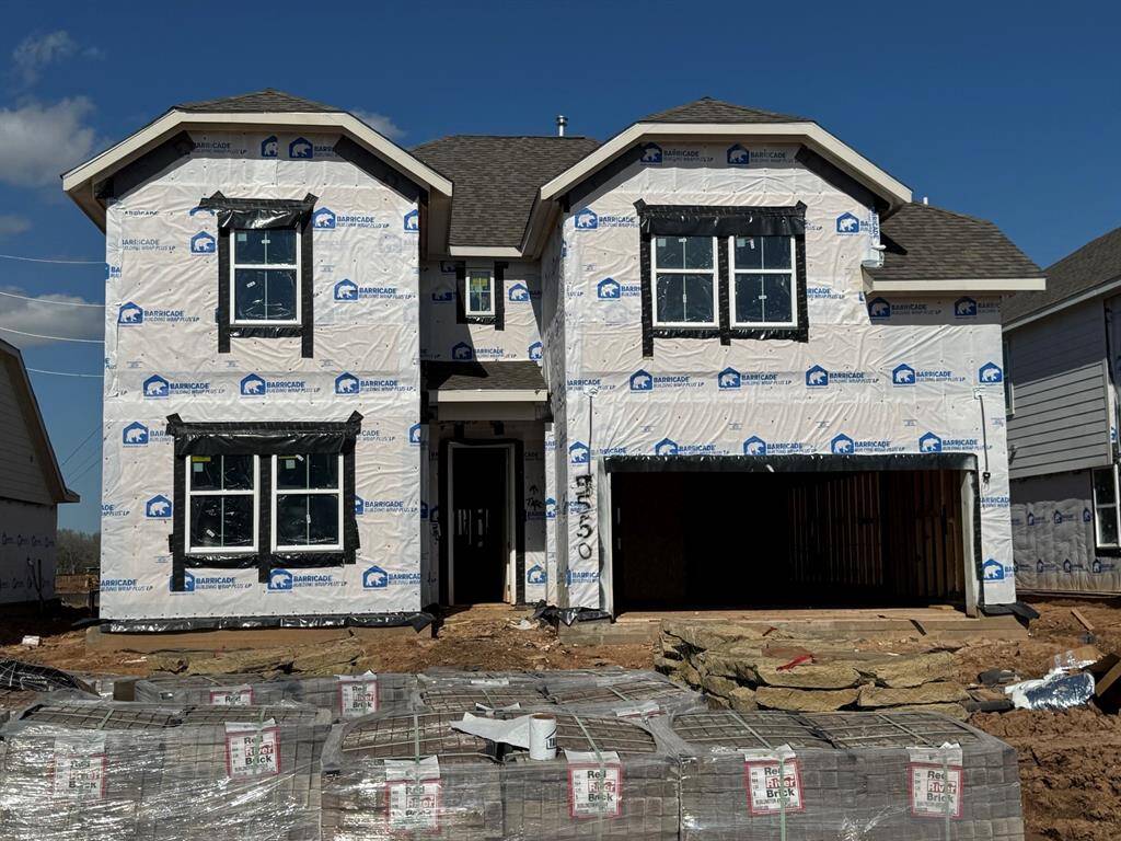 Two story home with 5 bedrooms, 4.5 baths, and 3 car garage.