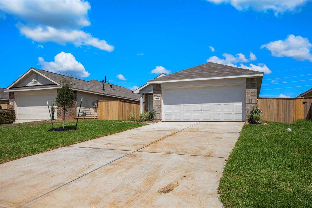 2 car garage and dual wide driveway.