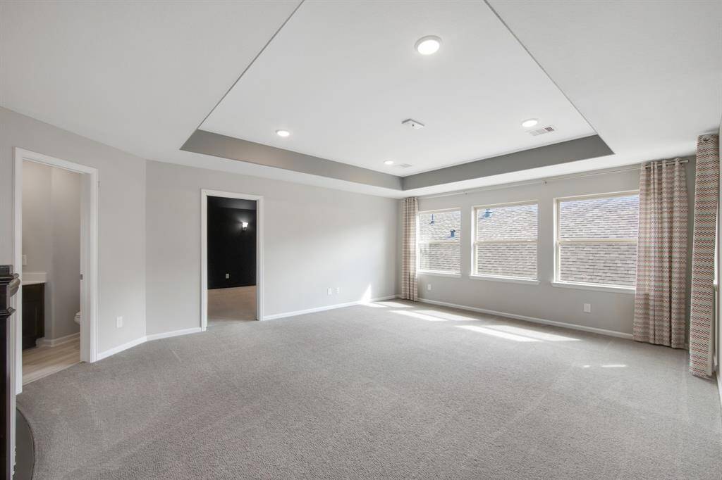 The door to the left is the upstairs 1/2 bath.  The door to the right is the theater/media room.  The game room has custom designer window treatment.
