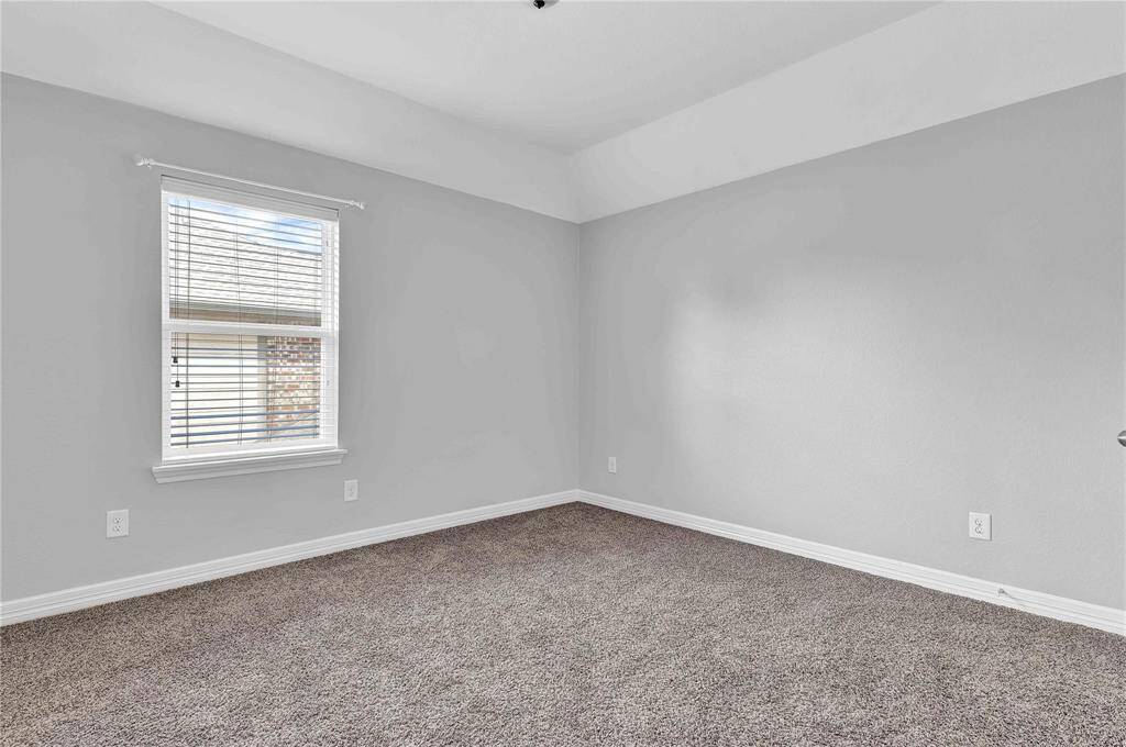 one of the 3 upstairs secondary bedrooms