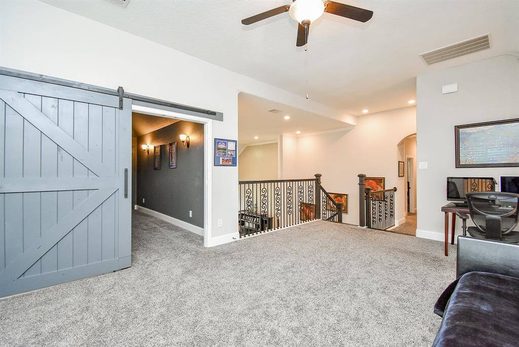 Gameroom up has a barndoor that leads to the media room