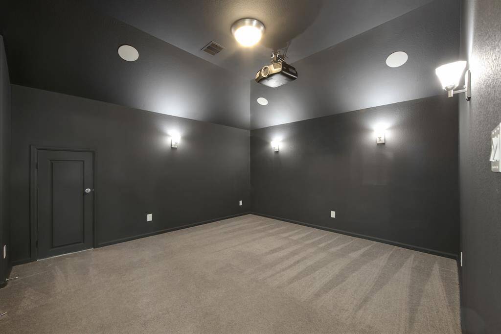 The mini-door on the left leads to the insulated attic with plywood over the rafters which can provide extra storage.