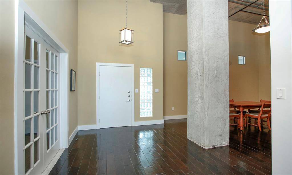 French doors open to the third bedroom. So much space in the entry that will fit all of your large furniture!