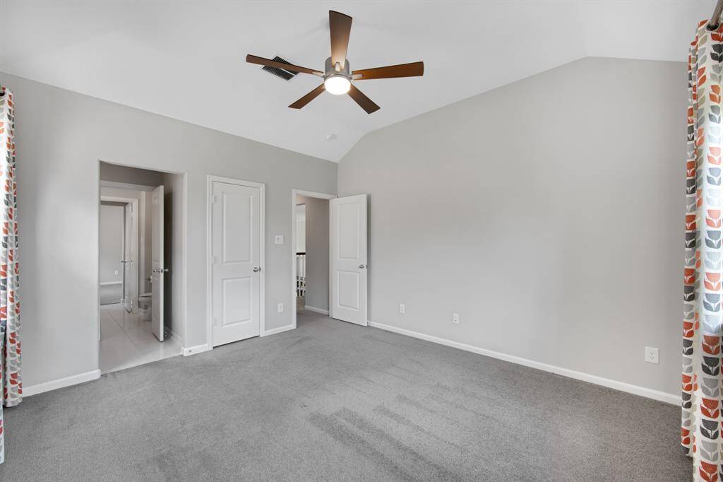 The opening to the left leads to the "Jack and Jill" bathroom which connects the 2 upstairs secondary bedrooms.  The door in the middle is a closet with plenty of room and the entry door to the right leads to the hall and the catwalk.