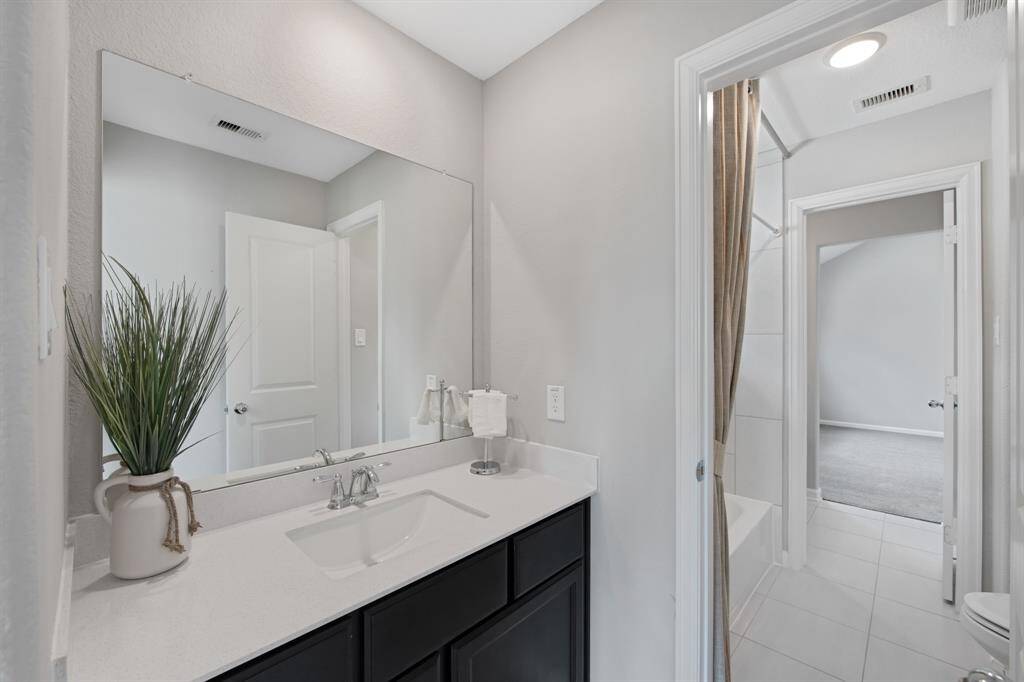 View of the "Jack and Jill" bathroom from the front secondary bedroom to the other secondary bedroom.