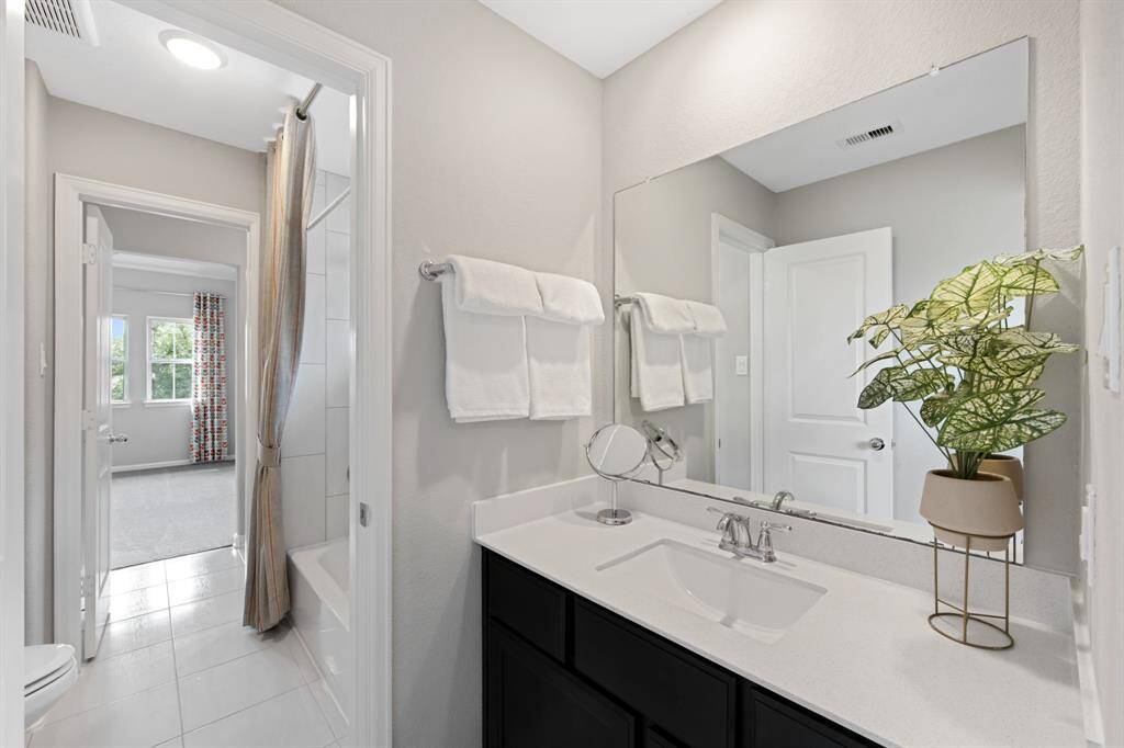 This is the "Jack and Jill" section of the upstairs secondary bedroom located in the midsection of the house.