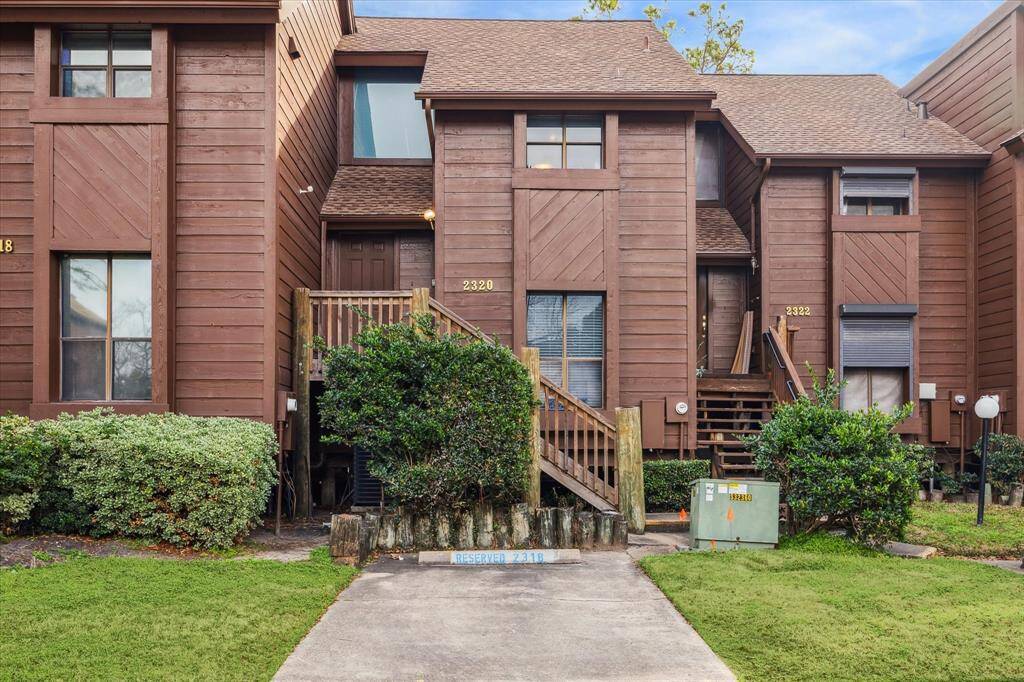 ENTRY WITH AN ASSIGNED PARKING SPACE, A PRIVATE GARAGE AND GUEST PARKING.