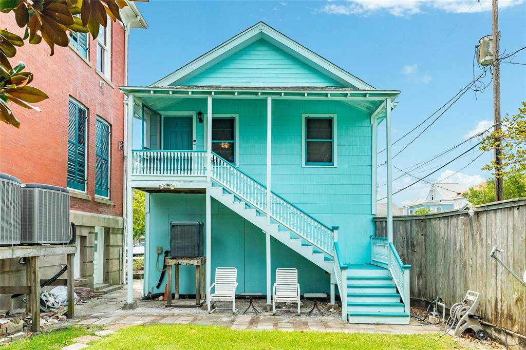 The front entry to the garage apartment comes up from the back yard.