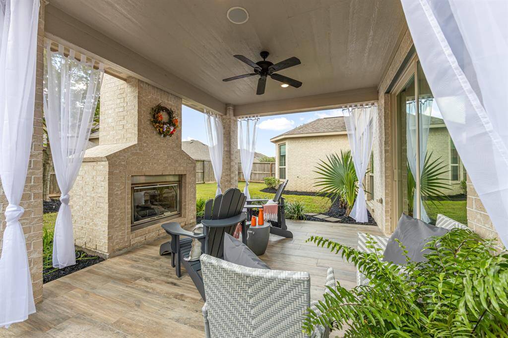 The covered back porch has been staged with listing agents items.  Please note that staging items do not transfer with the sale of the house.