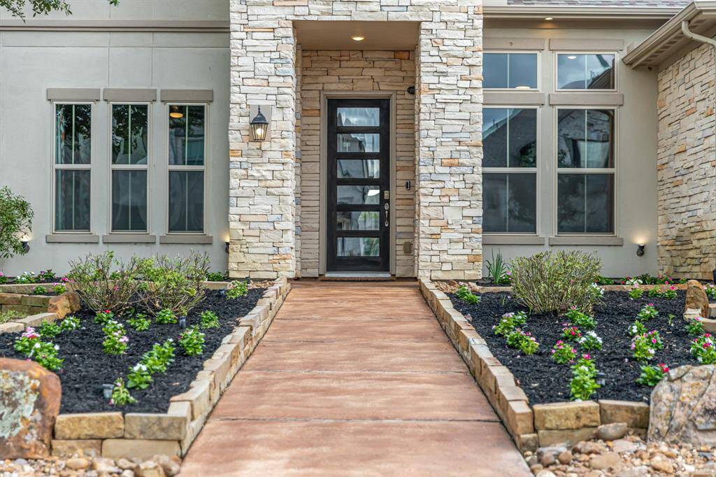 The elevation is accented with the exterior up-lights ($1,000.00).
