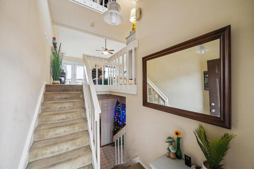 FOYER OPENS TO THE 1ST LEVEL BEDROOMS AND 2ND LEVEL LIVING AREA.