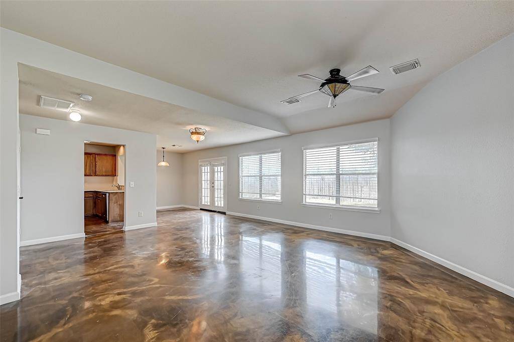 This spacious family room opens to the kitchen and breakfast area.