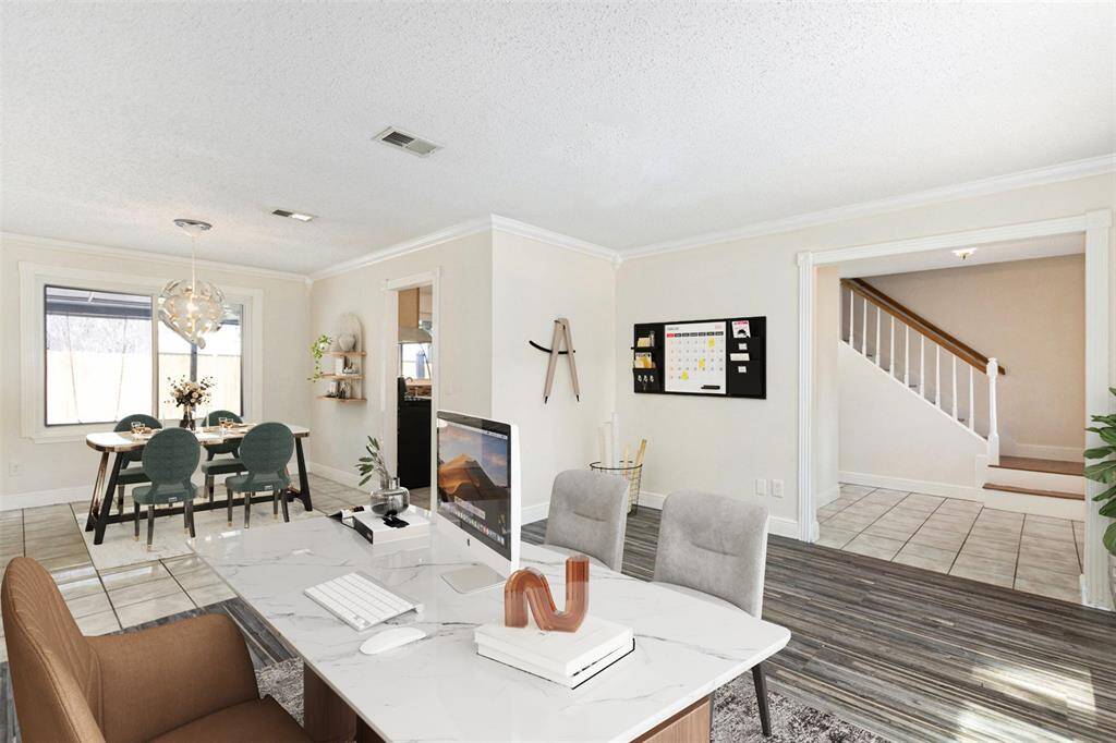 Off the entry is the home office and formal dining room. (Virtually Staged)