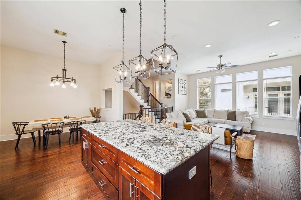 The Kitchen, the main hub of the home, shows off the open concept allowing you not to miss a second of action.