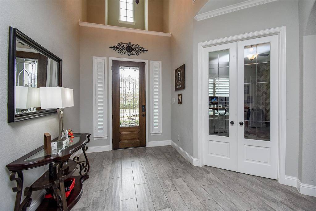 Lovely entrance into the home, with the corner study & french doors!