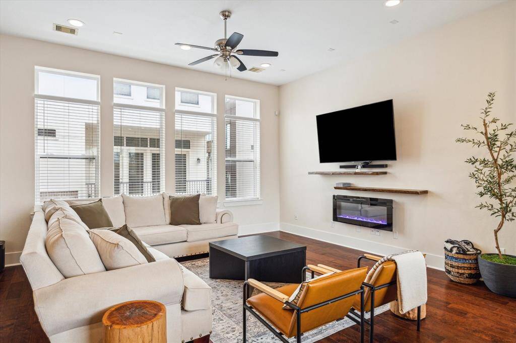 The Living Area features plenty of natural light through EIGHT South facing windows, has engineered wood floors high ceilings & recessed lights.