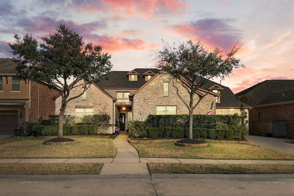 Stunning home featuring a spacious 3-car garage and a secure gated courtyard.