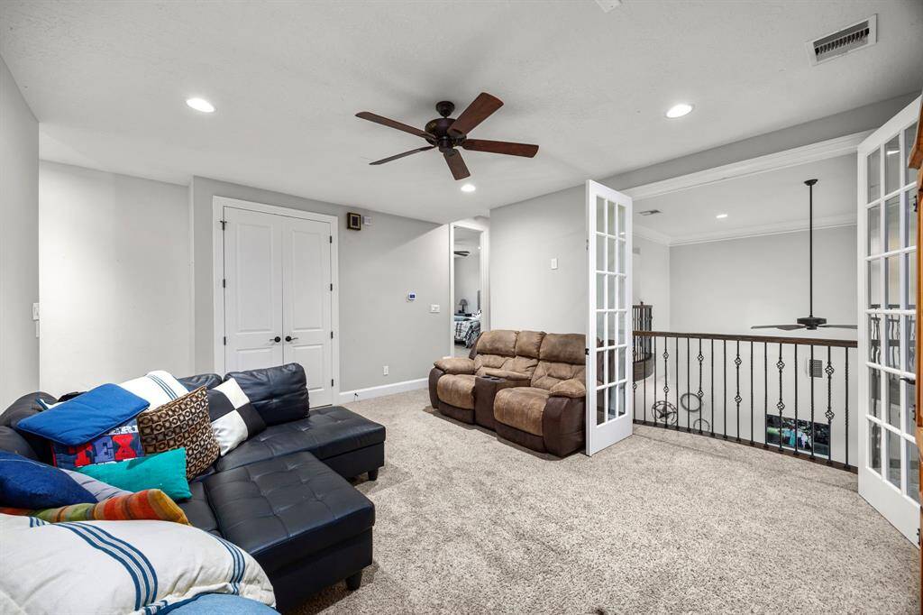Another view of the upstairs game with extra storage closets are a fabulous feature.