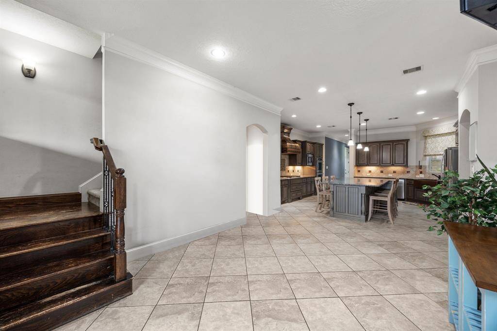 Cozy breakfast nook seamlessly connects to the kitchen and convenient back stairs.