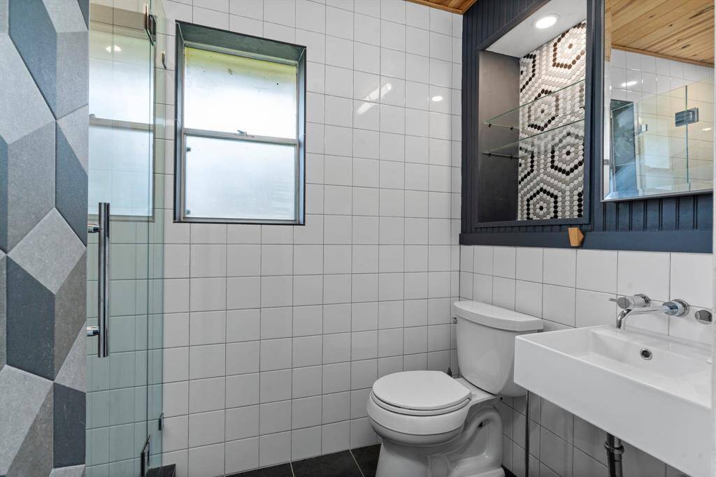 primary bath has custom tile