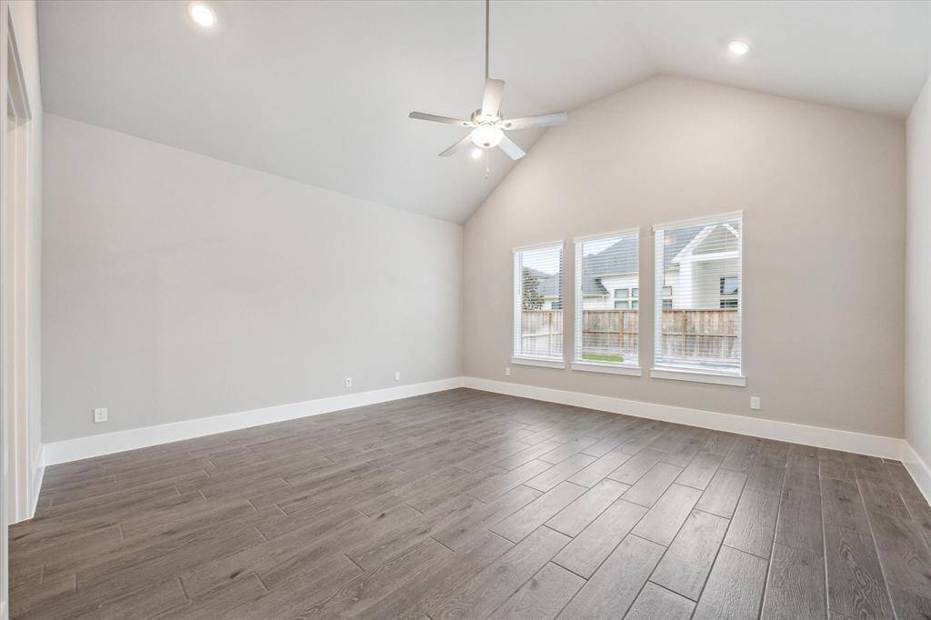 The Kitchen offers a premium appliance package with double ovens, 6 burner gas range and upgraded fixtures while the island offers plenty of additional seating and prep space. Upgraded pendant lighting sets a beautiful tone for the room.