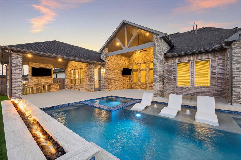 Vaulted covered patio with access to the kitchen is great for entertaining!  20 x 12 offers plenty of room for your spacious outdoor furniture. Large TV will stay with home.
