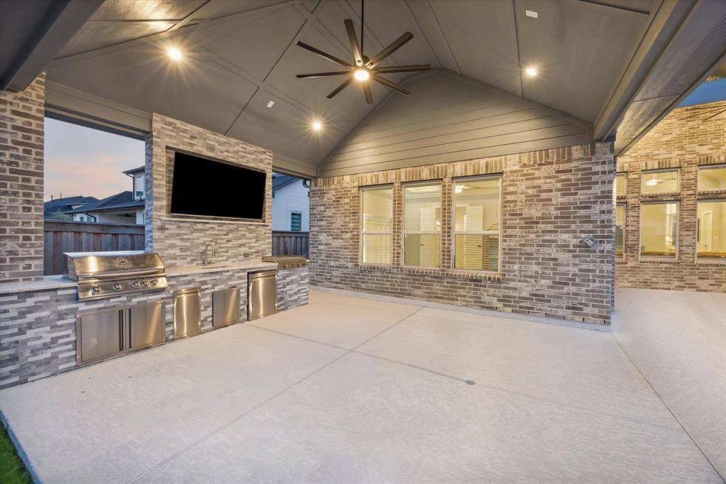 Oversized Tandem Garage has room for everything.  Custom covering makes the floors shine.