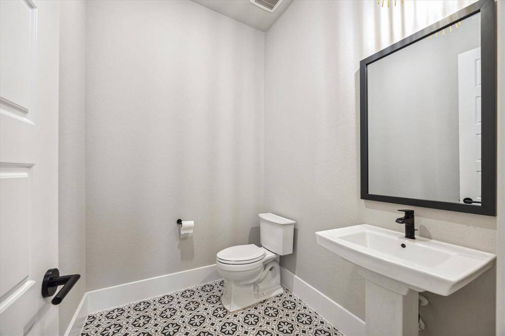 As you enter this elegant home with 14' Tray Ceiling, double chandeliers and upgraded wood look tile to compliment the soft neutrals tones.