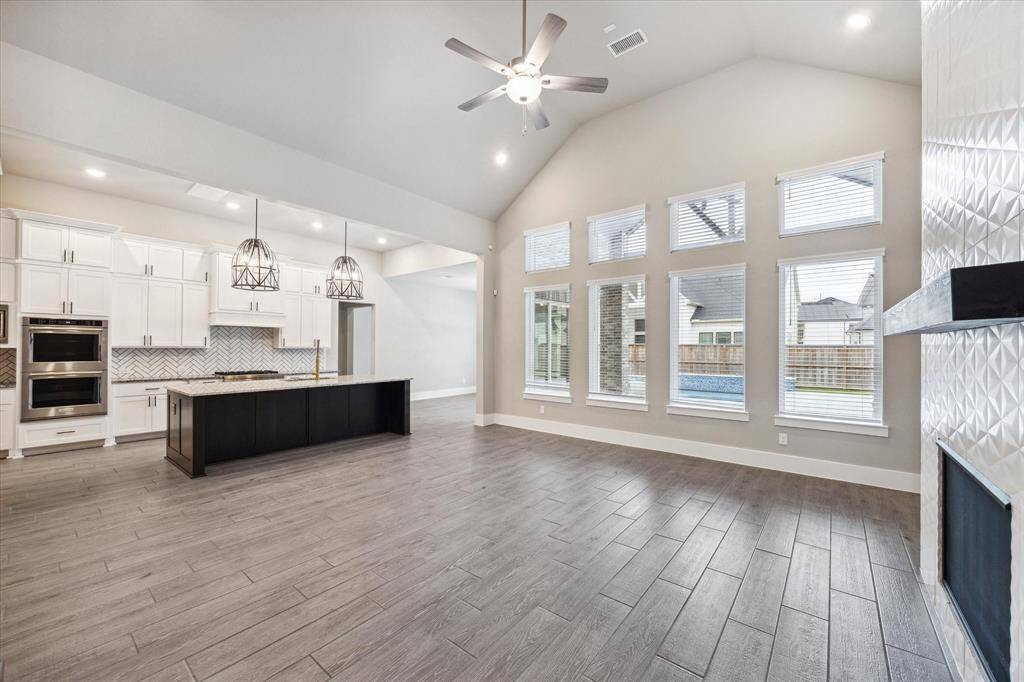 Large Powder Bath with upgraded decorative accent tile floors.