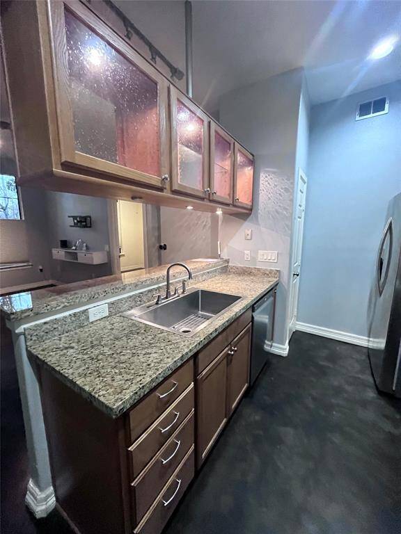 Large stainless sink w granite tops and dishwasher